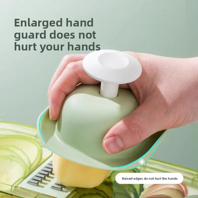 Household kitchen multi-functional slicing and shearing integrated vegetable cutting artifact