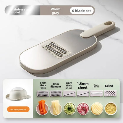Household kitchen multi-functional slicing and shearing integrated vegetable cutting artifact